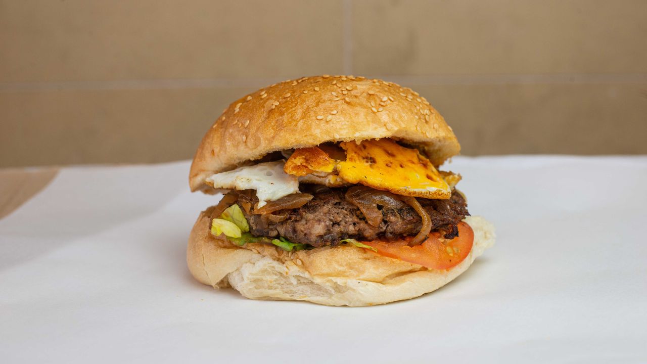 Large Village Burger with 130grs 100% Beef (or Marinated Chicken Breast Fillet) Layered on a Tast...