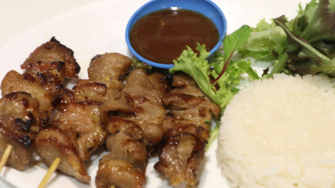 19. Pork Skewer with Sticky Rice