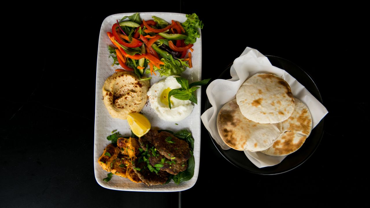 Taouk Chicken or Kafta, Greek Salad, Hommos, Garlic, Freshly Baked Bread