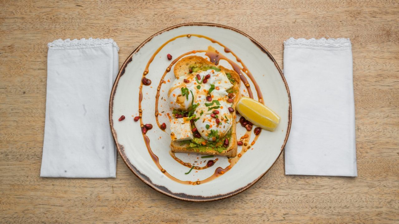 Smashed Avocado, Poached Eggs, Feta, Dukkah & Pomegranate Molasse