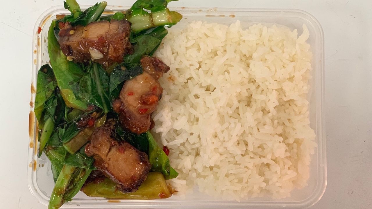 Stir Fried Chinese Broccoli with Crispy Pork on rice ผัดคะน้าหมูกรอบราดข้าว