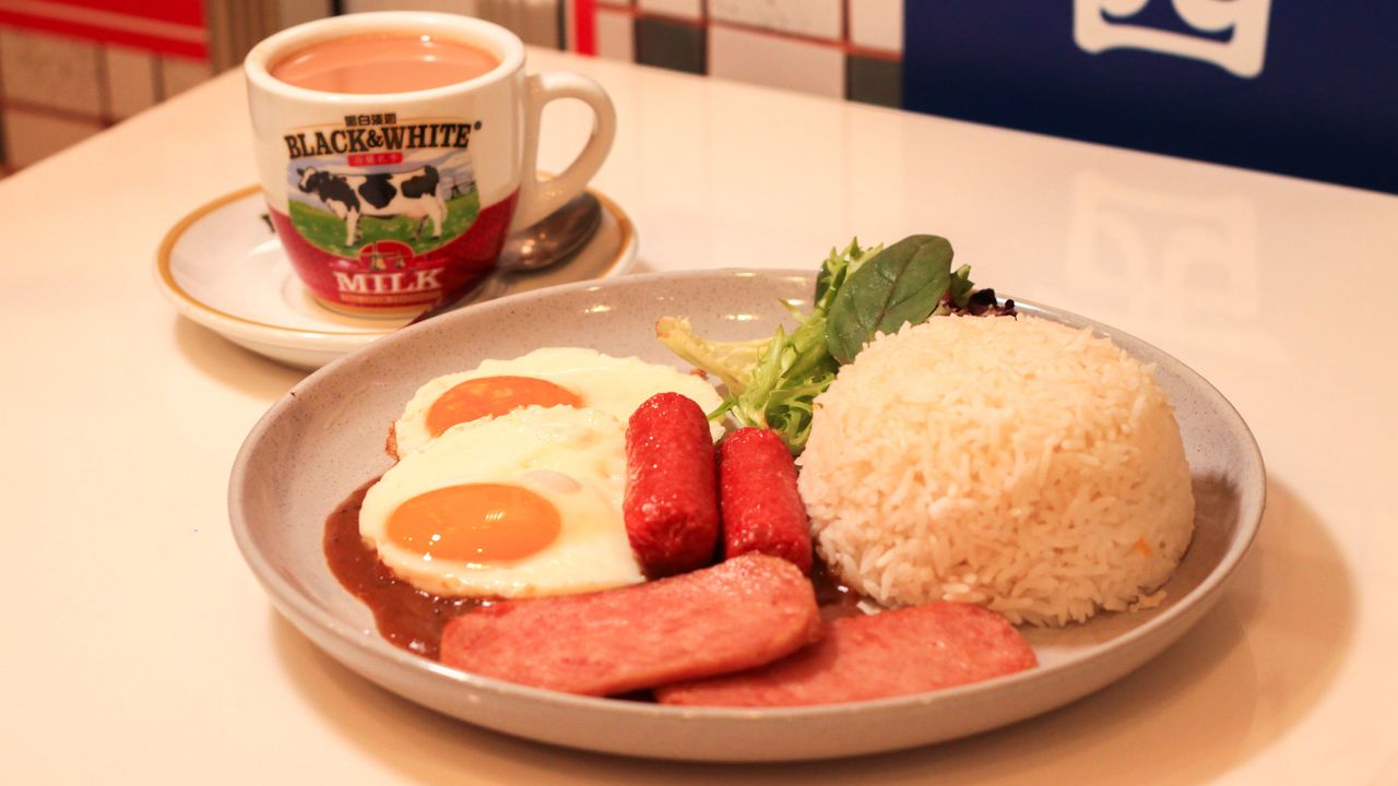Spam, Sausage and Fried Egg on Rice with Black Pepper Sauce
