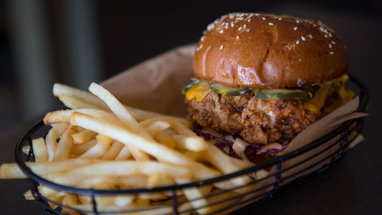 Fried Chicken Burger with Chipotle Aioli, American Cheddar, Slaw and Fries