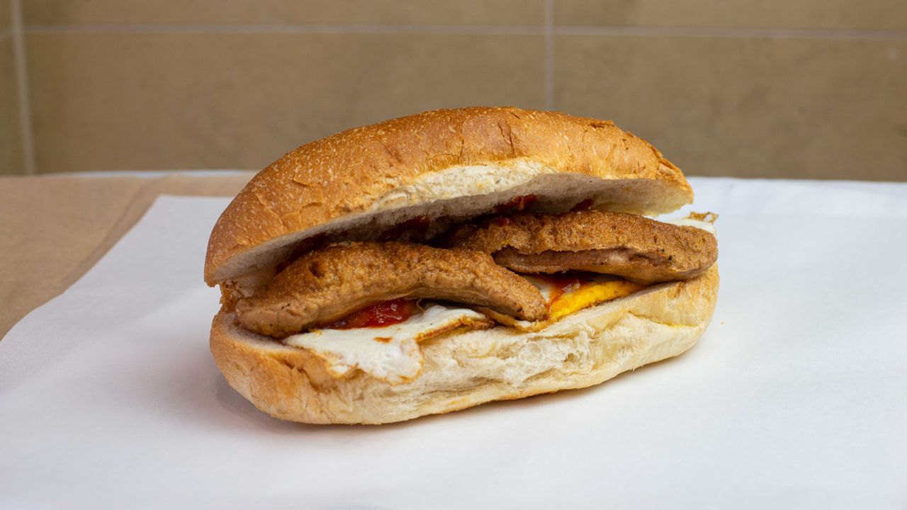Succulent Sausage & Grilled Eggs on a Toasted Turkish Bread Roll