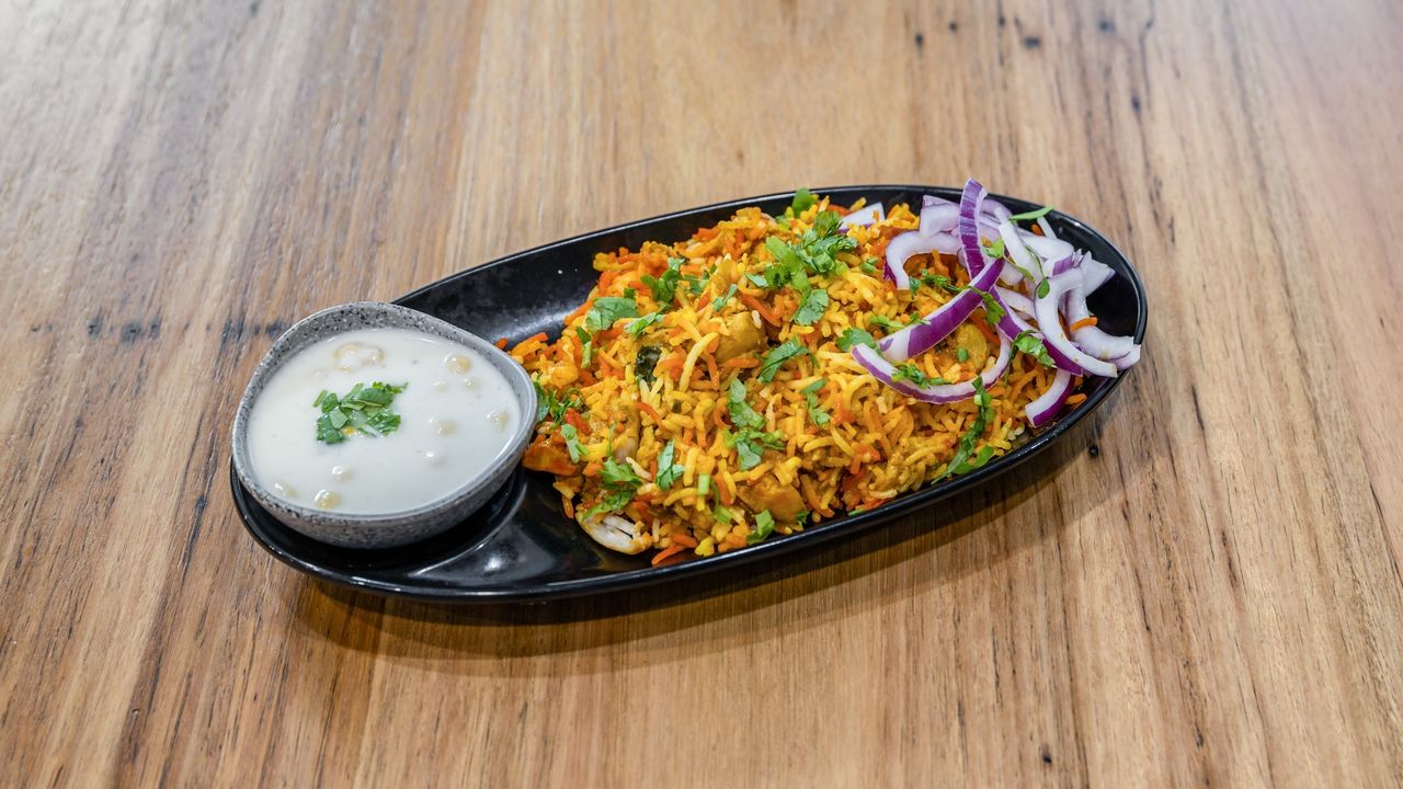 Chicken Biryani Served with Raita Yoghurt