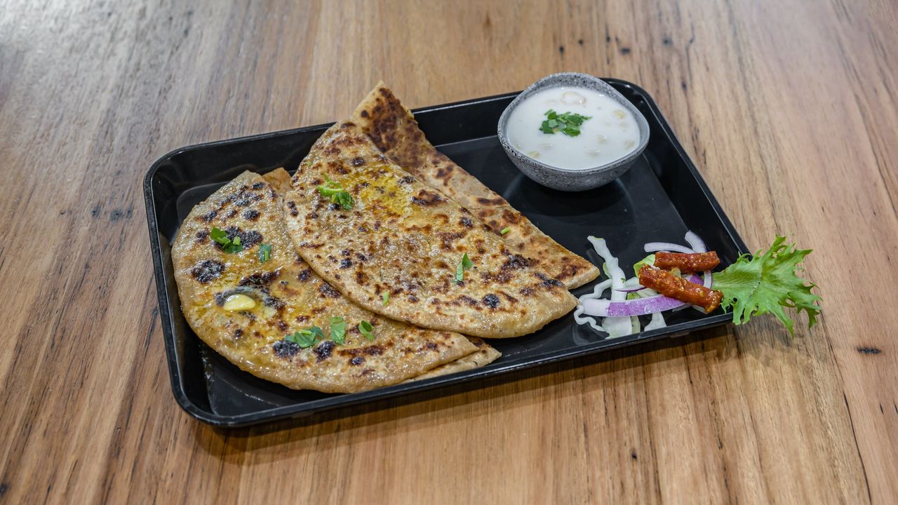 Aloo Stuff Parantha Served with Raita