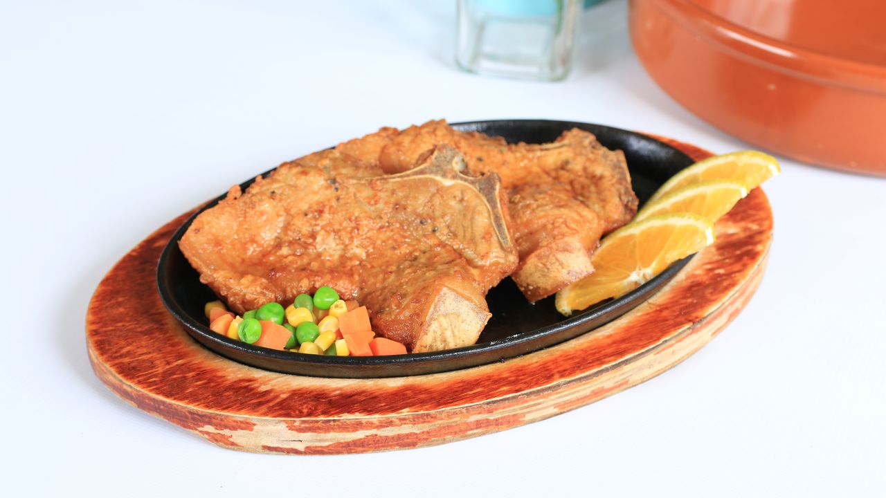 C10. Sizzling Pork Chop