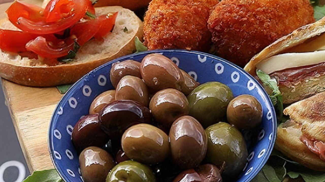 Warmed marinated olives