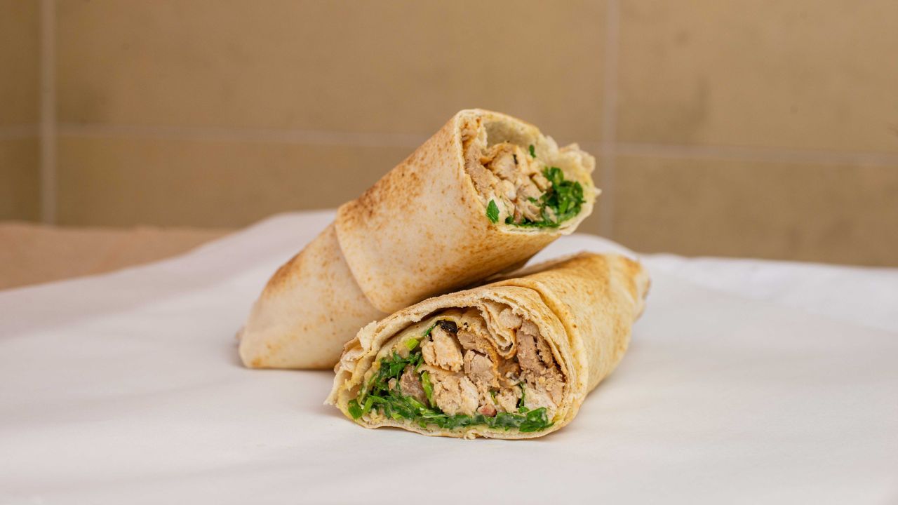 Pulled Chicken Off the Bone Wrap on a Bed of Hommus, Tabouleih, Wrapped in a Delicious Lebanese Wrap