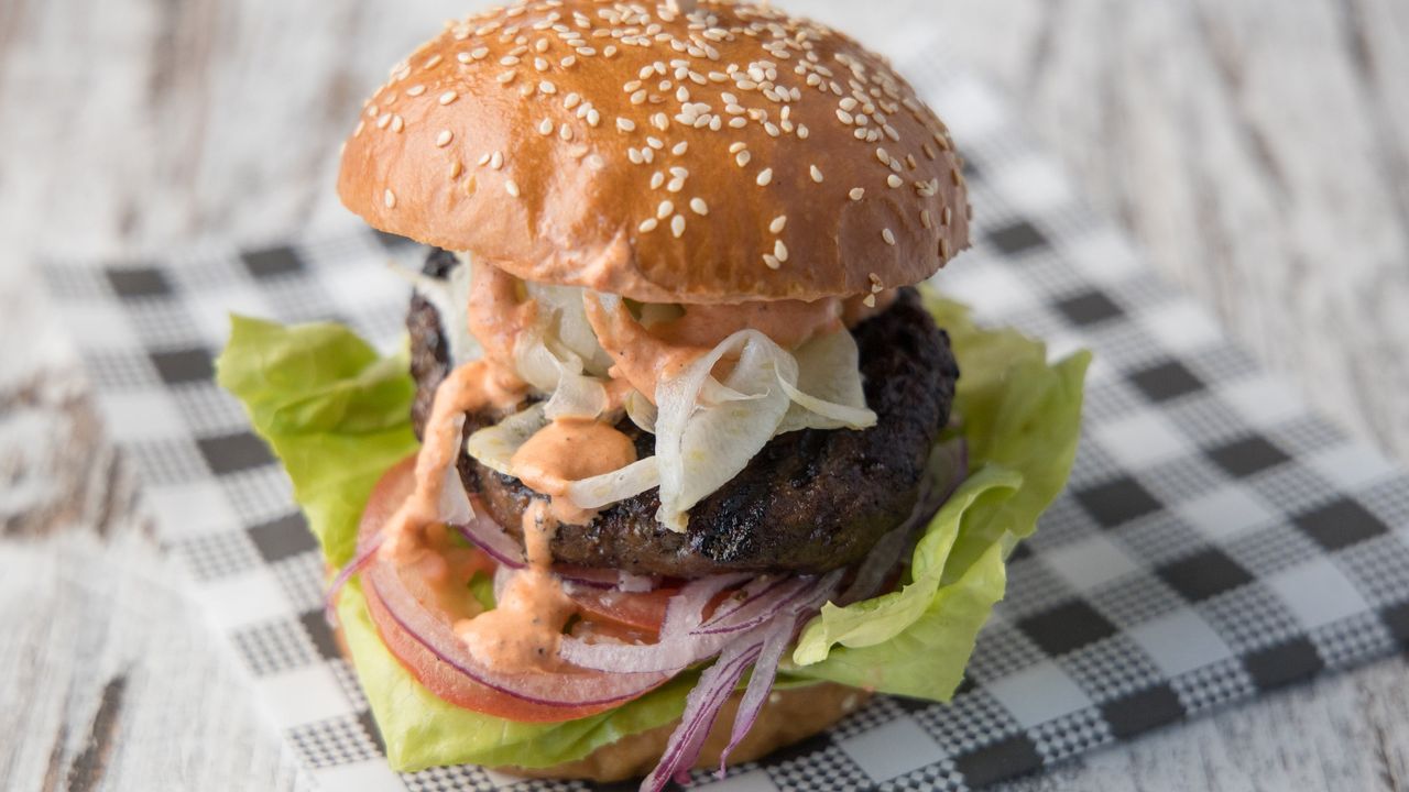 The Local Burger (GF) (DF) - Wagyu beef patty, home made sweet fennel pickles, tomato, onion, lettuce and our red sauce.