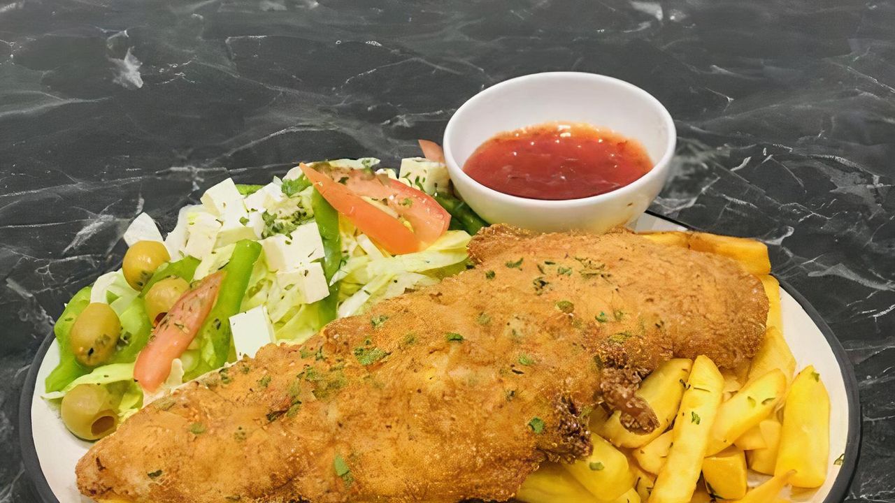 Chicken Schnitzel, Chips , Sauce & Greek Salad