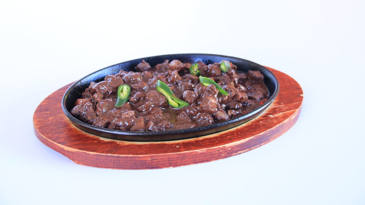 C12. Sizzling Dinuguan